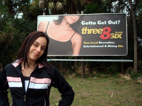 Sarah Posing With Her Three8Six.com Billboard